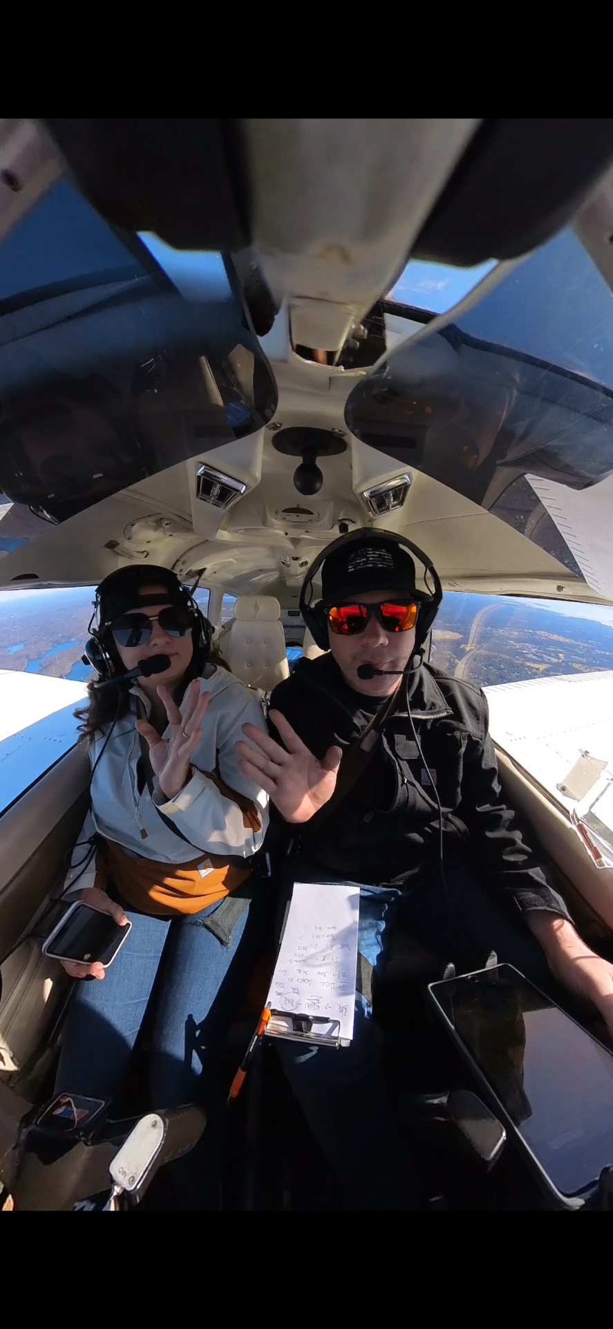 Katrina and Michael flying together in a small plane